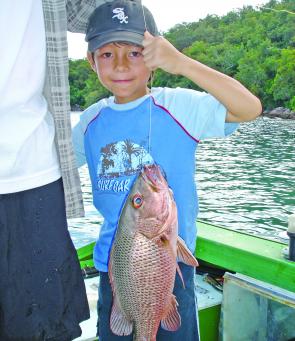 Jacob Standa with his first mangrove jack caught during a hot bite with his dad.